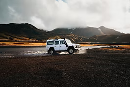 4WD driving through a river crossing on a remote off-road adventure — know your water levels with Topargee